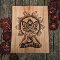 Wood burned mandala and person in meditation pose filled with nature elements