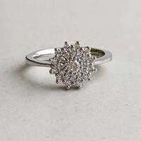 Platinum and diamond Flower Burst engagement ring