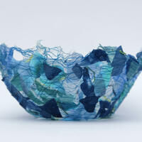 Blue thread bowl: water soluble fabric, fabric scraps and stitch.