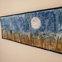 Moon over Marsh: screen printed cotton and mixed media. Machine and hand stitch.