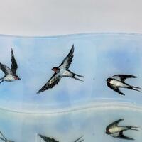 Swallows wave in fused glass