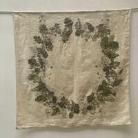 Large piece of antique linen with a circle of oak leaves, eco printed and hand embroidered. 