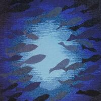 Tapestry of a shoal of fish against a background of a blue sea.