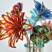 Kiln-formed fused glass flowers. Intricate glass cutting, meticulous glass placement, unique copper stems.