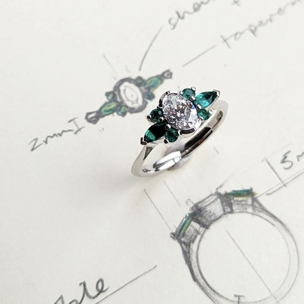 Bespoke platinum, lab grown diamond and natural emerald engagement ring with hand drawn sketch 