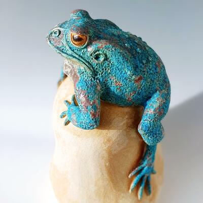 Decorative toad on boulder, height 45cms