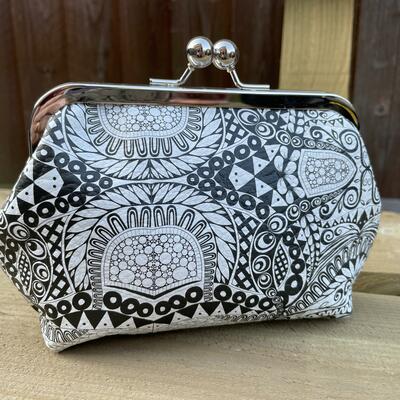 Kiss lock purse with black and white digitally printed leather
