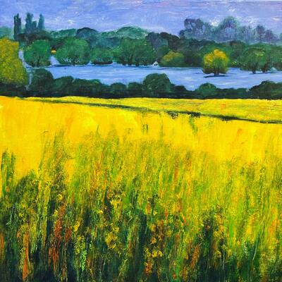 yellow textural field in front of distant linear reservoir with submerged and surrounding trees