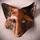 Copper fox mask with scrathed lines and cut out eyes and nostrilsapproximately 20cm wide