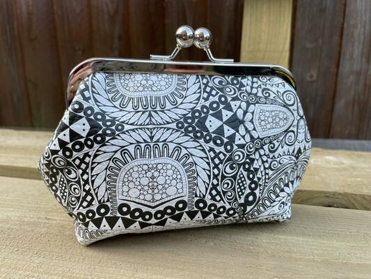 Kiss lock purse with black and white digital print