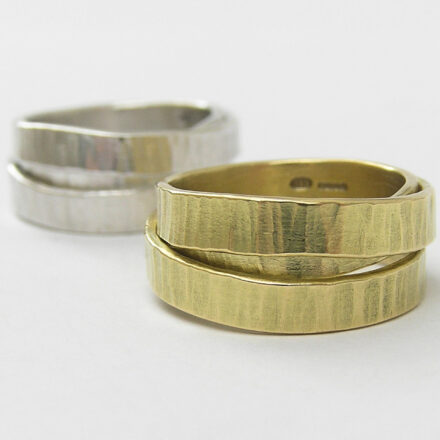 Anna K Baldwin Orbit rings shown in silver, and 18ct gold