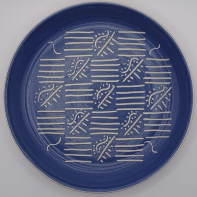 Fiona Wilcock: Slip coated and carved plate. Earthenware.