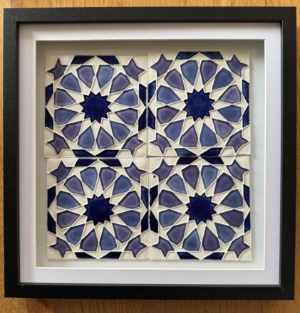 Framed porcelain tiles using a twelvefold rosette design