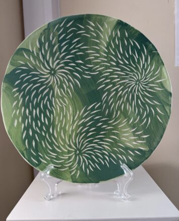 Slip coated and carved platter. Earthenware.