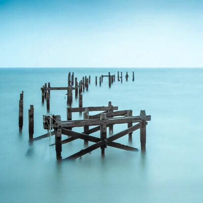 Stuart Feurtado: Derelict pier in a flat sea